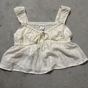 Cream Sleeveless Peplum Top